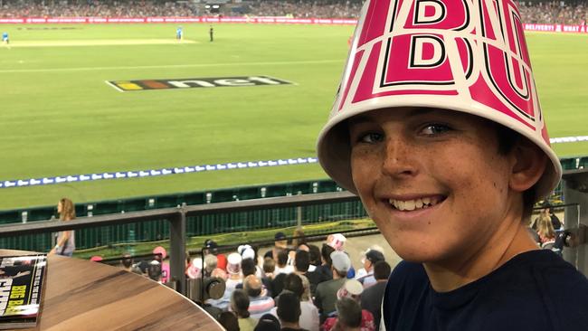 A Sixers fan enjoys a Big Bash match in Coffs Harbour.