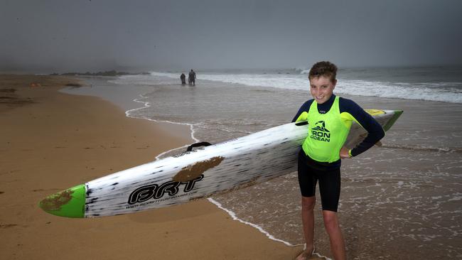 Noah Ray prepares to go out for a surf despite a heavy sea mist rolling in at Burnie. Picture: CHRIS KIDD