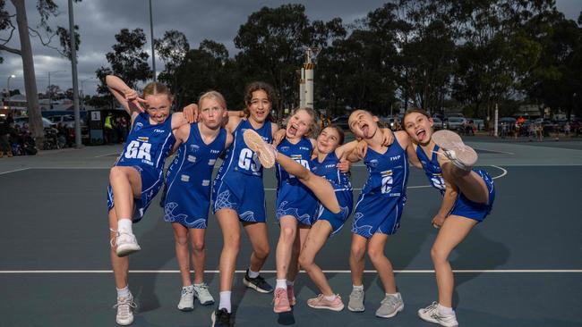 Anglesea White under-11 netball team pull their funniest faces.