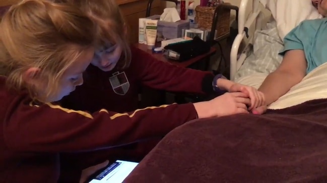 This is the emotional moment young twin girls sing a Kylie Minogue song to their dying mum.