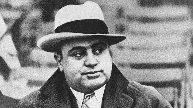 FILE - In this Jan. 19, 1931 file photo, Chicago mobster Al Capone attends a football game in Chicago. On Thursday, Feb. 14, 2013, the Chicago Crime Commission and the Drug Enforcement Administration are scheduled to name Joaquin Guzman Loera, a cartel kingpin in Mexico, as the new Public Enemy No. 1. It will the first time since Prohibition-era gangster Capone that authorities in the city deemed a crime figure so ominous a threat to deserve the label. (AP Photo/File) Picture: Ap