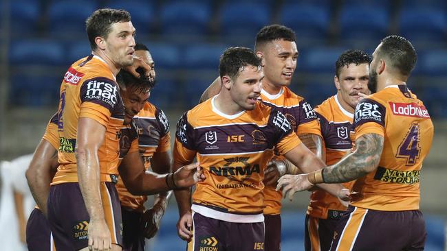 Alex Glenn (second from L) celebrates a try with teammates. Picture: Getty