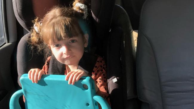 Nina Miska, 5, and her mother Renata had to wait four hours in the car to get through the NSW/QLD border checkpoint.