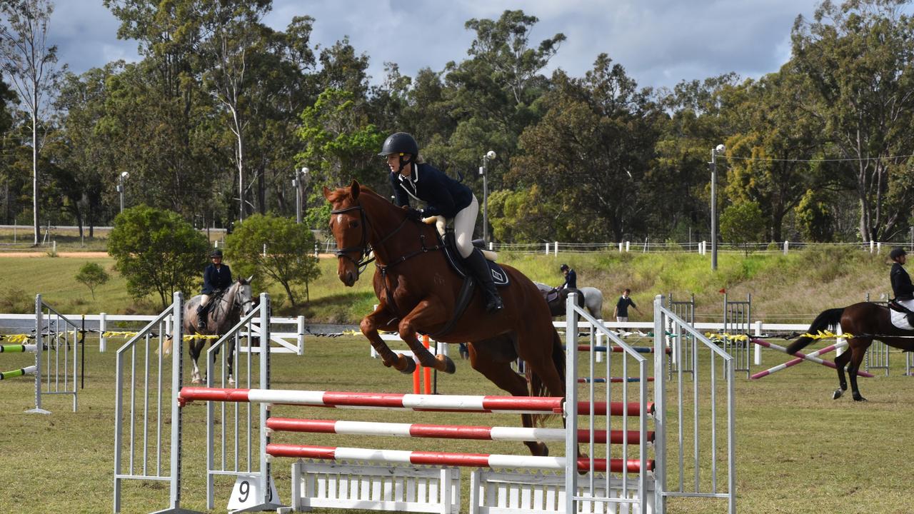 Emily Perina and her horse Ginger in the show jumping ring at the Fraser Coast Ag Show for 2021. Photo: Stuart Fast