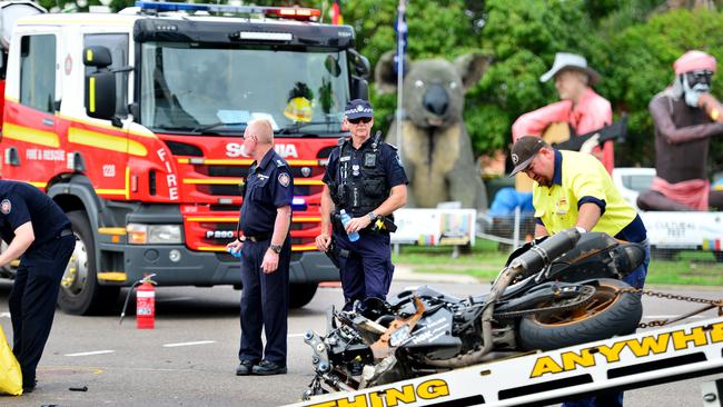 Emergency services at the scene of a fatal crash between a motorcycle (deceased) and car. Picture: Alix Sweeney