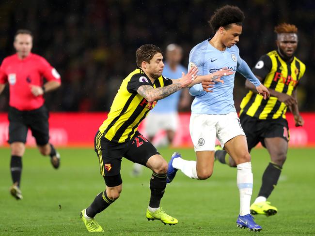 WATFORD, ENGLAND - DECEMBER 04:  Leroy Sane of Manchester City is challenged by Kiko Femenia of Watford during the Premier League match between Watford FC and Manchester City at Vicarage Road on December 4, 2018 in Watford, United Kingdom.  (Photo by Richard Heathcote/Getty Images)