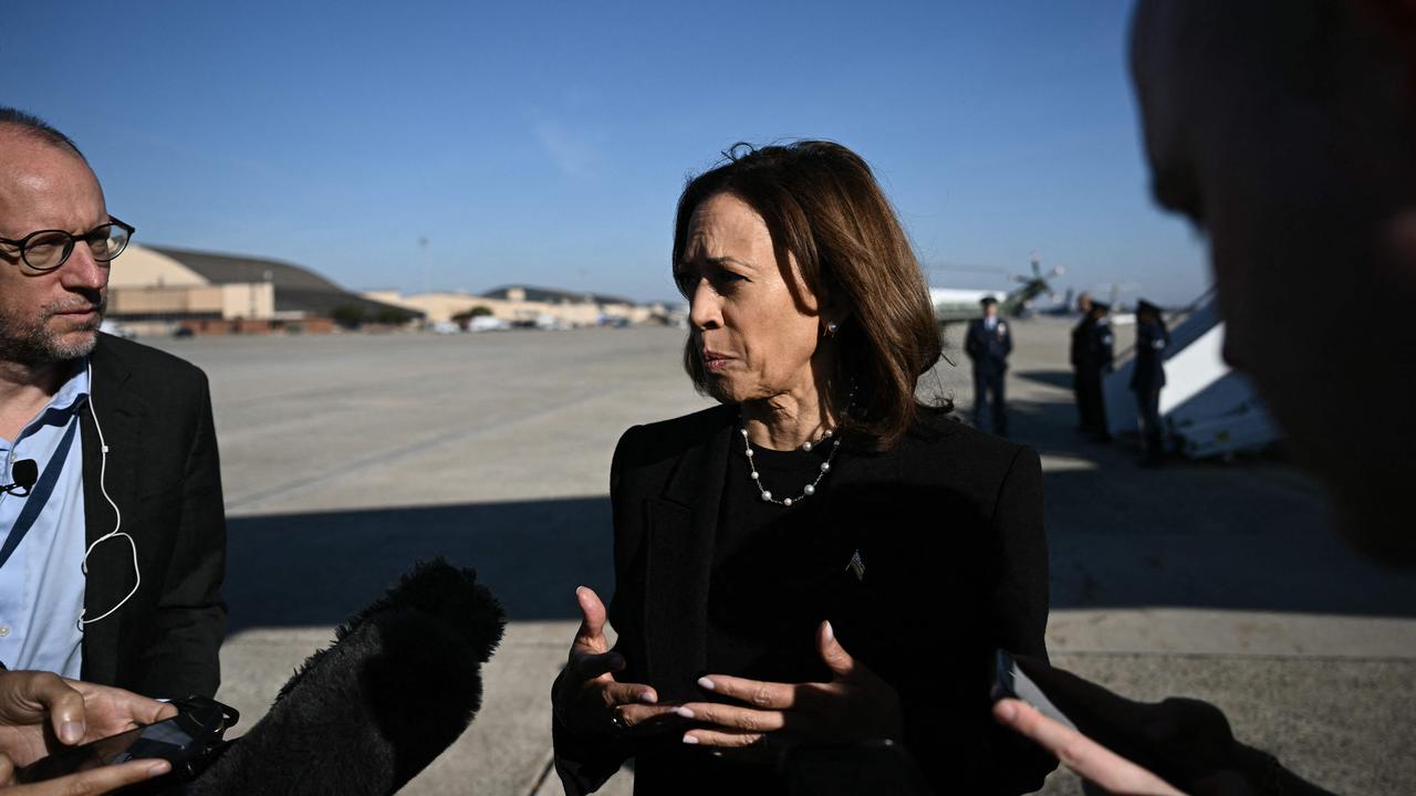 US Vice President and Democratic presidential nominee Kamala Harris talks to reporters before boarding air force Two at Joint Base Andrews in Maryland on October 30, 2024. (Photo by Brendan SMIALOWSKI / AFP).