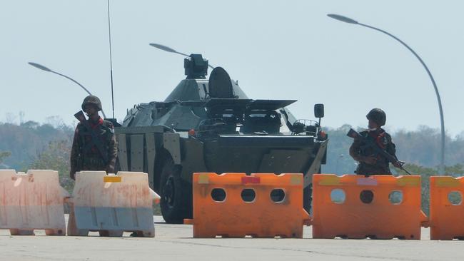 Soldiers blockade a road to Myanmar's parliament in the capital Naypyidaw on Monday. Picture: AFP