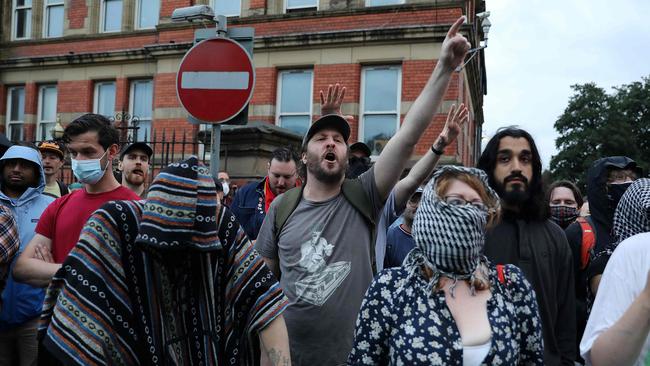 Protesters shouts slogans defending the Abdullah Quilliam Mosque. Picture Ian Cooper/AFP