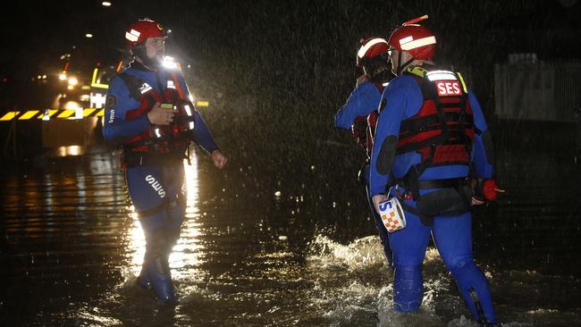 SES Crew in flooded Church street, Cabramatta. as heavy rain causes flooding across Sydney. Picture: John Appleyard