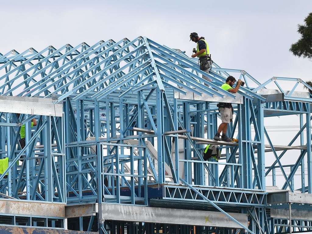 Construction workers are seen working on a new housing development at Kellyville, west of Sydney, Wednesday, March 25, 2020. (AAP Image/Dan Himbrechts) NO ARCHIVING