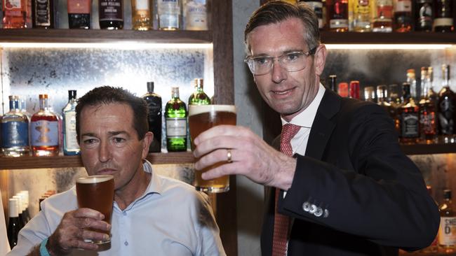 NSW Premier Dominic Perrottet, right, and Deputy Premier Pail Toole drink a beer on ‘Freedom Day’ in Sydney. Picture: Getty Images