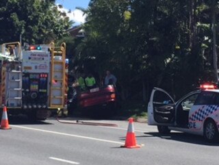 A man has been injured when his car rolled on Central St, Arundel this morning. Photo: Jessica Elder