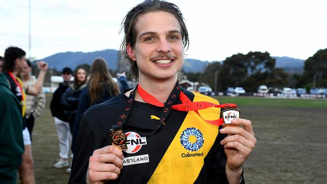 Double dangle: Jesse Cherry of Mitcham poses with his premiership and best on ground medals. Photo by Josh Chadwick