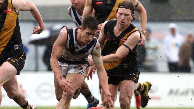 Nathan Thomas battles Lachie Wilson for the ball. Picture: Hamish Blair