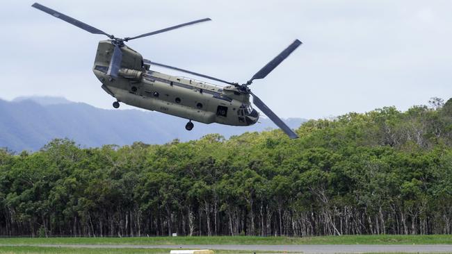 An Australian Army Chinook helicopter takes off from the Cooktown Airport, bound for the Indigenous community of Wujal Wujal. The entire town of Wujal Wujal has been evacuated following the flood emergency, with the majority of the town staying at the Cooktown PCYC, which is set up as an evacuation centre by the Australian Red Cross. Picture: Brendan Radke