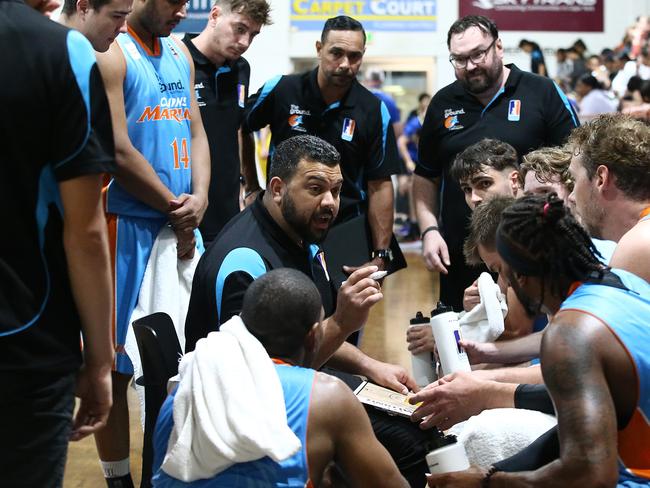 Marlins head coach Kerry Williams rallies his players during a time out in the NBL1 North match between the Cairns Marlins and the Townsville Heat, held at Cairns Basketball Stadium. Picture: Brendan Radke