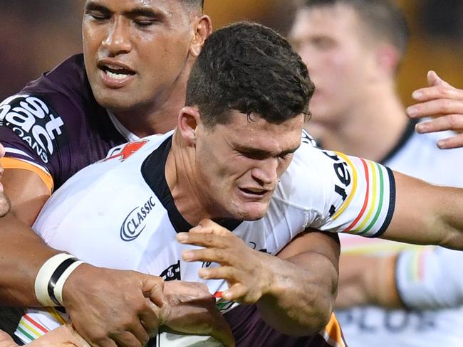 Nathan Cleary (centre) of the Panthers is tackled by Andrew McCullough (left) and Tevita Pangai Junior (2nd from left ) and Patrick Carrigan (right) of the Broncos during the Round 22 NRL match between the Brisbane Broncos and the Penrith Panthers at Suncorp Stadium in Brisbane, Friday, August 16, 2019.  (AAP Image/Darren England) NO ARCHIVING, EDITORIAL USE ONLY