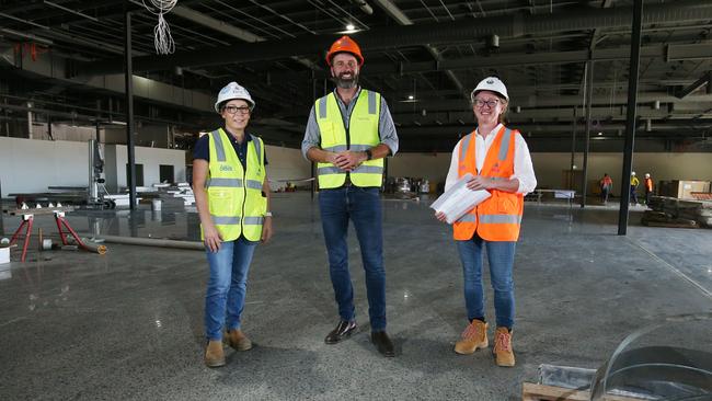 Woolworths Gordonvale project manager Luellen Burton of ADCO Constructions, Woolworths state development manager Chris Sheehan and regional development manager Marissa Hopewell stand inside the new supermarket. Picture: Brendan Radke