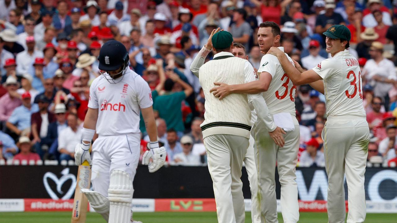 Australia's Josh Hazlewood celebrates with teammates after taking the wicket of England's Ben Duckett. (Photo by Ian Kington / AFP)