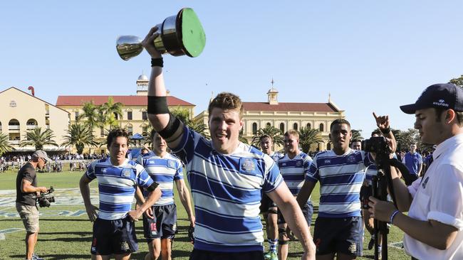 Nudgee captain Harry Vella with the trophy after winning the competition in 2018. Picture: Mark Cranitch