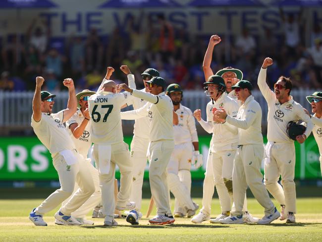 The Aussies celebrate after Lyon’s 500th Test wicket was confirmed. Picture: James Worsfold - CA/Cricket Australia via Getty Images