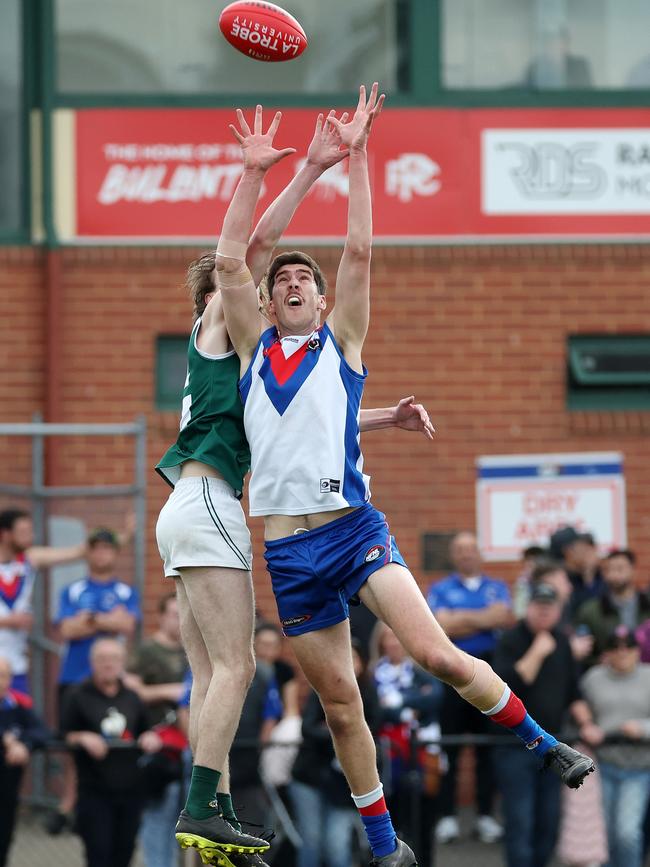 NFL: West Preston Lakeside’s Matthew Harman flies against Thomas Brindley of Greensborough. Picture: George Sal