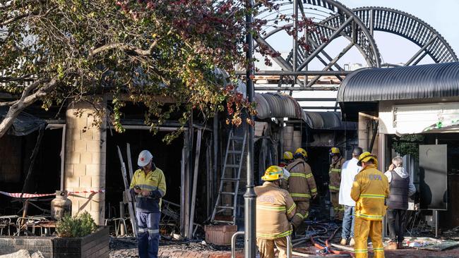 Firefighters attend the scene where multiple properties were destroyed by fire in Gilbert Street, Torquay. Picture: Brad Fleet