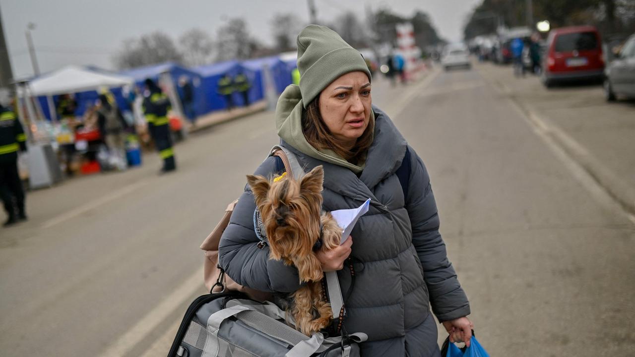 A woman fleeing her home in Kramatorsk, in northern Donetsk Oblast, crosses the Ukrainian-Romanian border in Siret, northern Romania. Picture: Armend Nimani/AFP