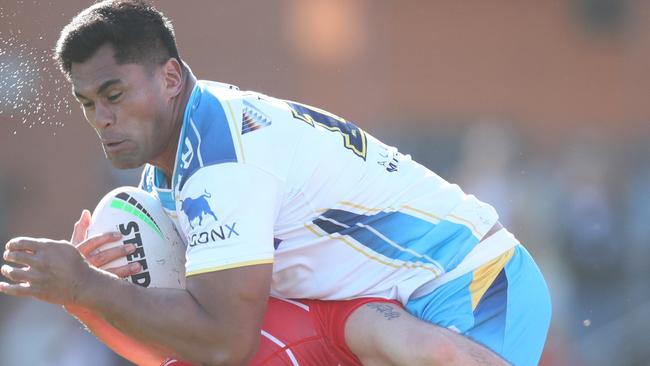 Herman Ese'ese is being chased by Wayne Bennett’s Dolphins. Picture: Getty Images