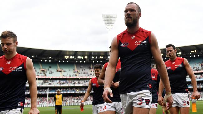 The Demons walk off after their loss to Collingwood. Picture: AAP Images