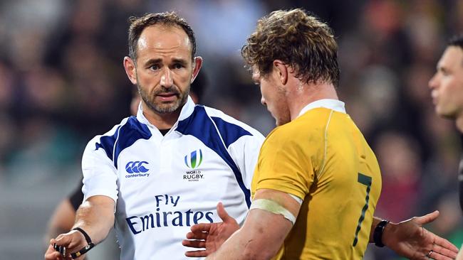Referee Romain Poite warns Australia’s Michael Hooper of scrum infringements during Saturday night’s Bledisloe Cup clash with New Zealand.