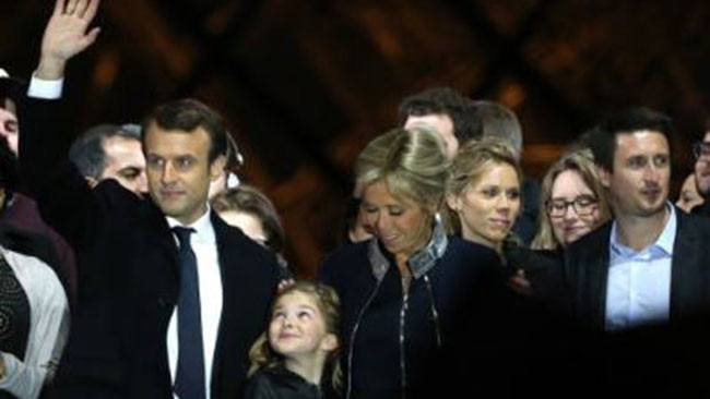 Tiphaine Auziere (2nd R) with Brigitte and Emmanuel Macron celebrate him winning the presidency. Picture: Getty Images.