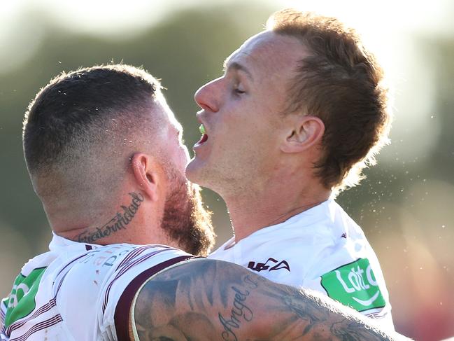 Manly's Joel Thompson celebrates after scoring a try with Manly's Daly Cherry-Evans during the Cronulla v Manly NRL match at Southern Cross Group Stadium, Cronulla. Picture: Brett Costello