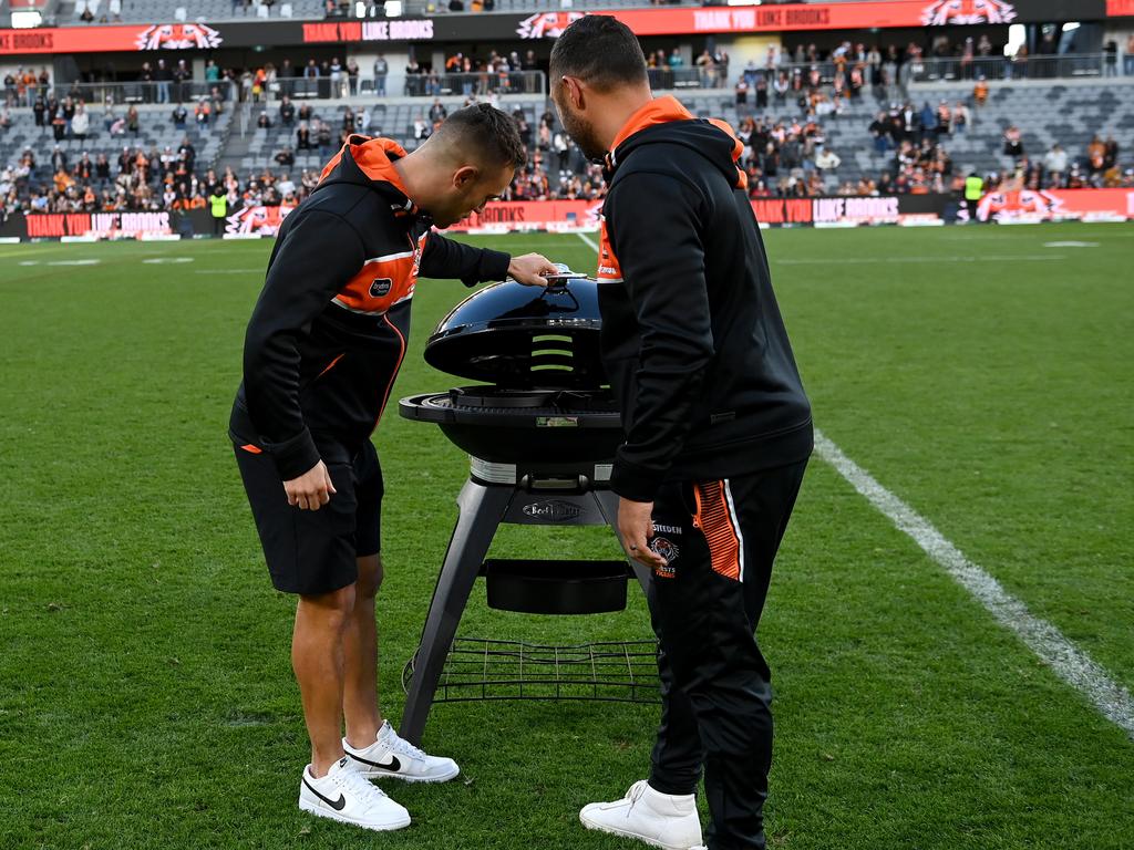 Luke Brooks inspects his parting ‘gift’ from the Wests Tigers.