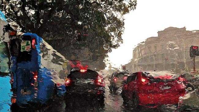 Central Sydney distorted by rain on a windscreen, New South Wales. Picture: Nitin Saksena