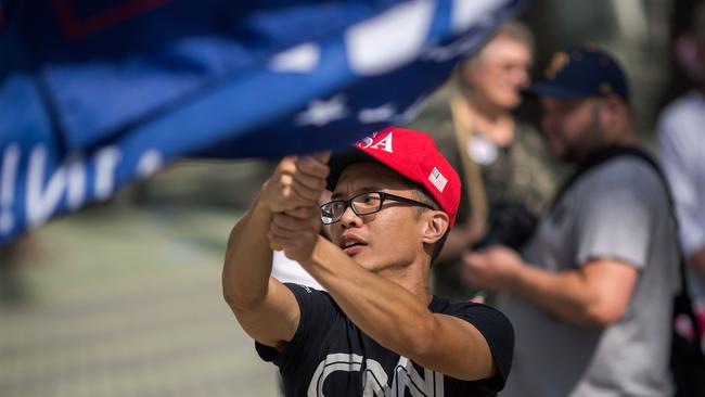 A pro-Trump demonstrator waves a flag outside the Anaheim Convention Center. Picture: AFP