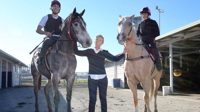 Cancer survivor and horse trainer Gillian Heinrich (centre) with Ben Rodgers (L) on a and Maggie Harrison. Picture: Richard Gosling.