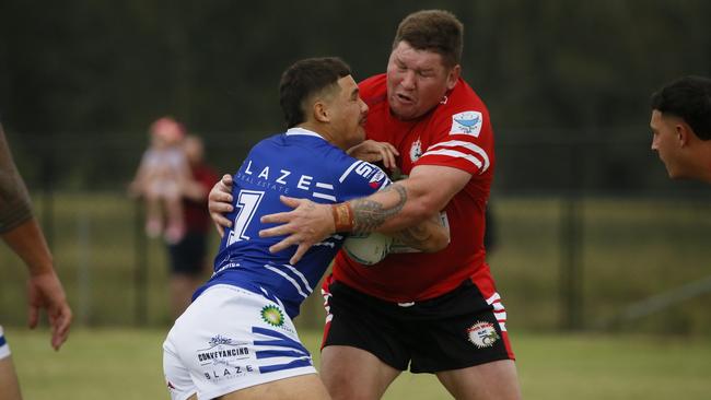 ShaneKIEL is tackled by Greg EastwoodMacarthur Rugby League,   Sunday 17 March.Kirkham Park, Camden Valley Way, Elderslie NSW 2570, Australia, Elderslie NSWMen's First Grade: Narellan v South WestPhotos Warren Gannon Photography