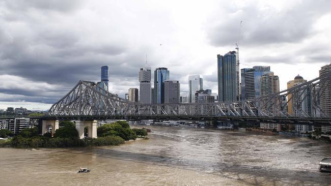 Police have warned of the dangers of the swollen Brisbane River as the city’s flooding disaster continues. Picture: Tertius Pickard