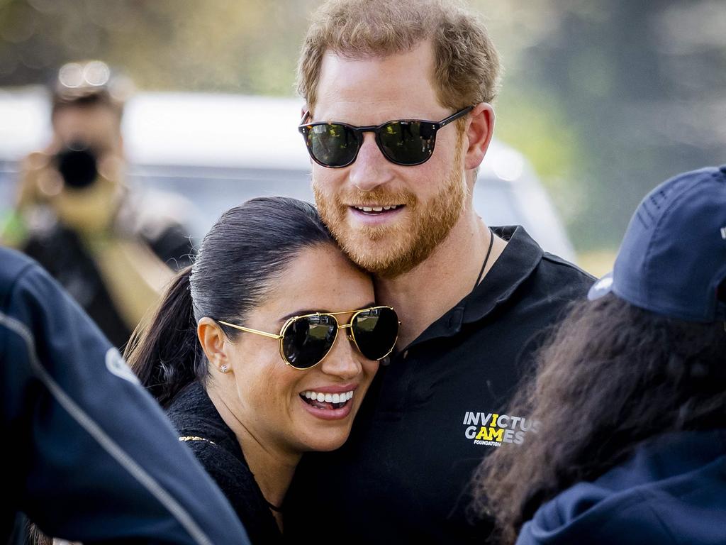 The Duke and Duchess of Sussex, Prince Harry (R) and his wife, Meghan Markle embrace at The Invictus Games in The Hague. Picture: AFP / Netherlands OUT