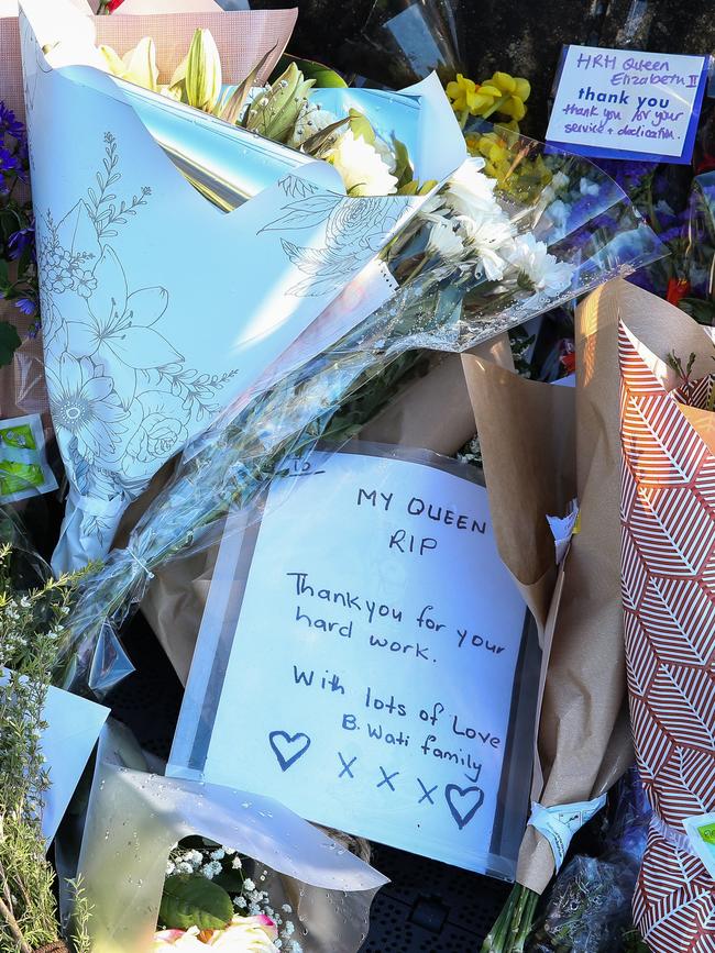 Hundreds of bouquets of flowers and personal notes have been placed outside Government House in Sydney. Picture: NCA Newswire /Gaye Gerard