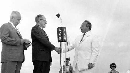 Alderman Len Peak and Mayor Ern Harley congratulate Stanley Korman at the opening ceremony of the bridge to Chevron Island.