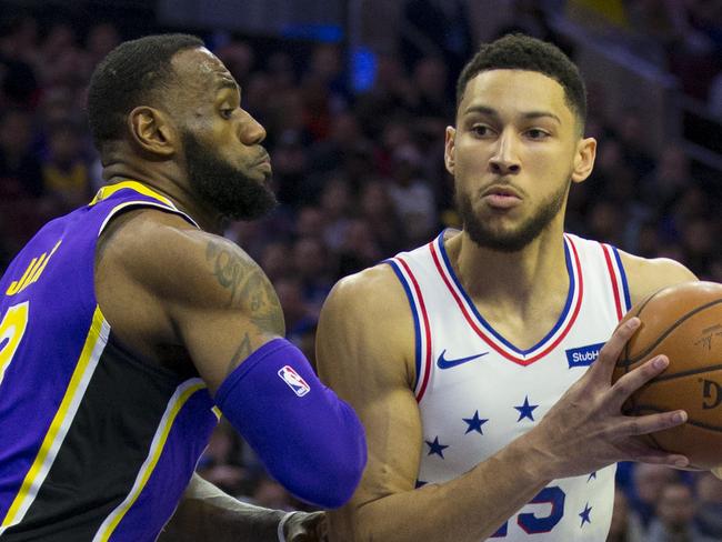 PHILADELPHIA, PA - FEBRUARY 10: Ben Simmons #25 of the Philadelphia 76ers controls the ball against LeBron James #23 of the Los Angeles Lakers at the Wells Fargo Center on February 10, 2019 in Philadelphia, Pennsylvania. The 76ers defeated the Lakers 143-120. NOTE TO USER: User expressly acknowledges and agrees that, by downloading and or using this photograph, User is consenting to the terms and conditions of the Getty Images License Agreement.(Photo by Mitchell Leff/Getty Images)