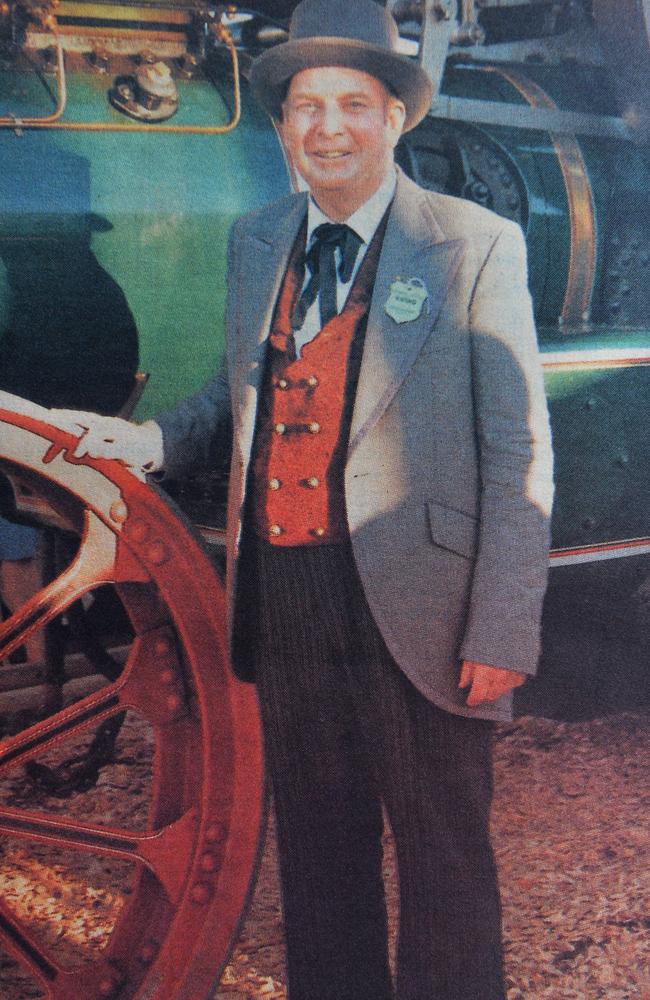 Historical society president Jim Buchanan in period costume in front of a 1911 Garrett engine.