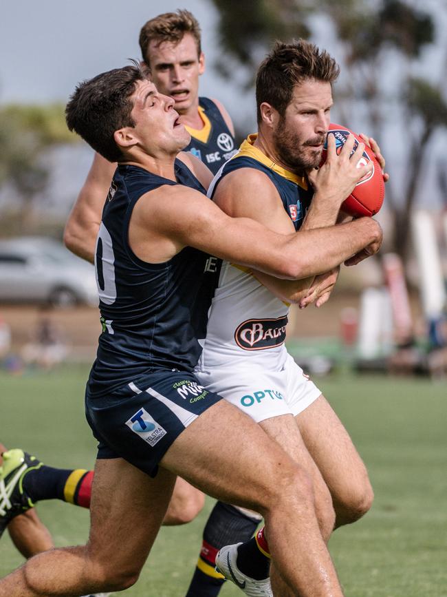 Jesse McKinnon tackling Matthew Wright during the South Adelaide versus Adelaide game at Noarlunga Oval. Picture: AAP Image/ Morgan Sette