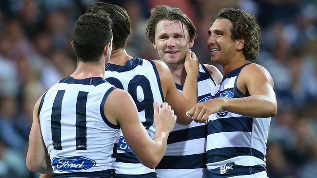 Patrick Dangerfield is congratulated after kicking a goal.