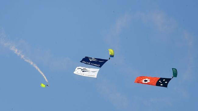 Skydivers deliver the Territory flag and Darwin Cup flag at the Darwin Cup 2022. Picture: (A)manda Parkinson