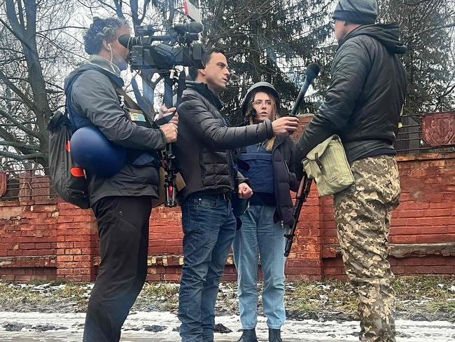 This undated image courtesy of Fox News shows (from L) cameraman Pierre Zakrzewski, US journalist Trey Yingst and Ukrainian journalist Oleksandra 
