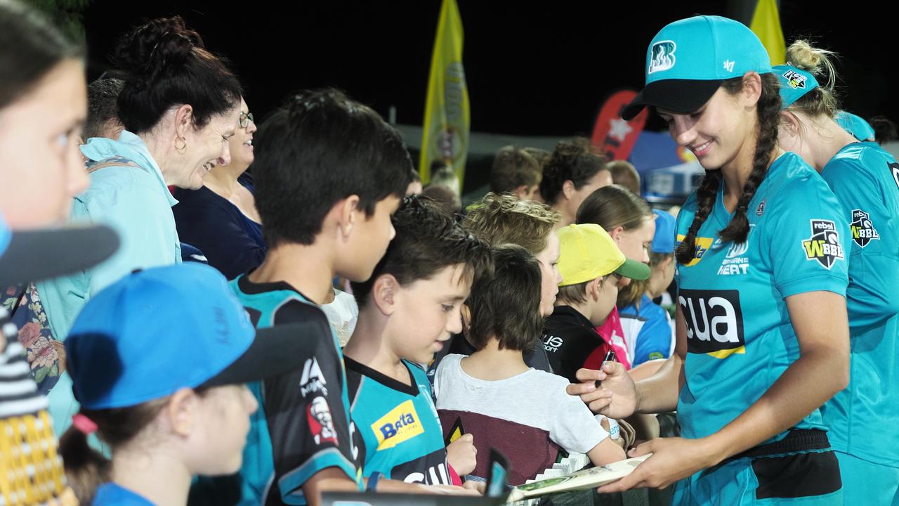 Mackay cricketer Charli Knott meets some Brisbane Heats fans at Harrup Park.